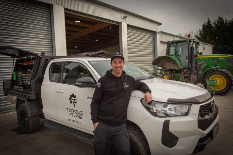 Matt leaning on the Torque and Tune Hilux outside the workshop