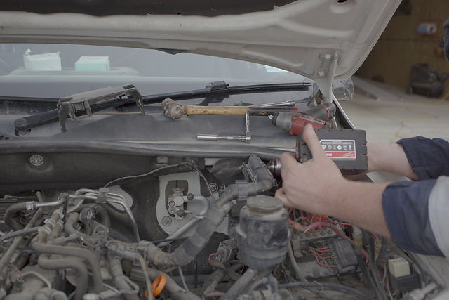 Working on a diesel engine bay at the Torque + Tune bench